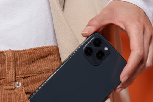 Person taking iPhone out of pocket