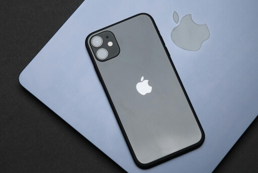 iPhone lying on top of MacBook