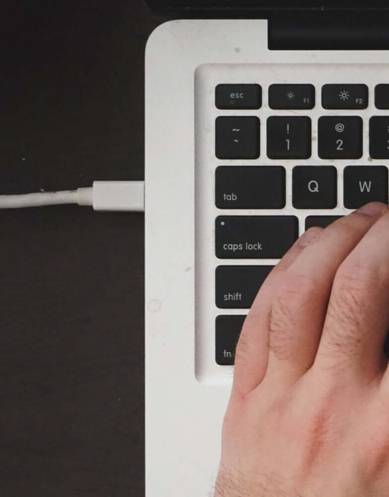 Charging cable connected to MacBook