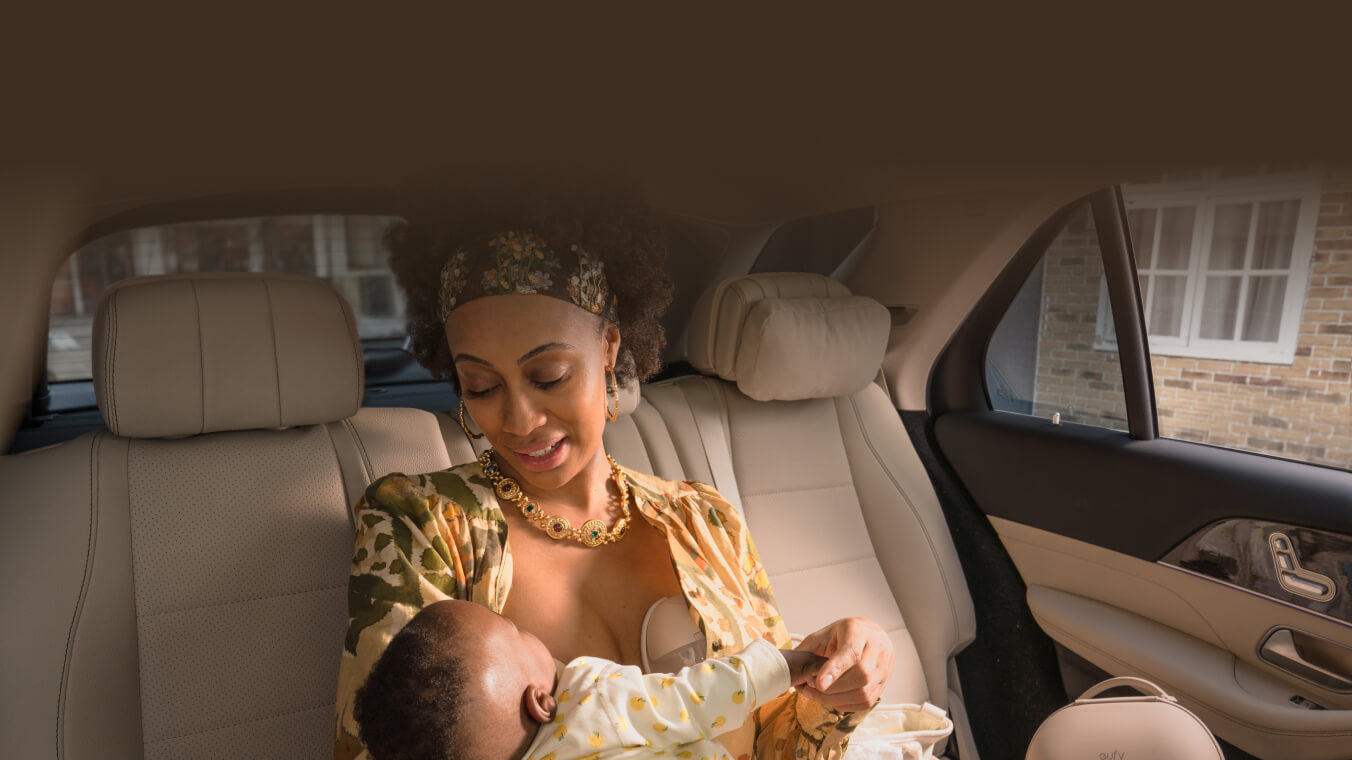 Lady feeding her baby