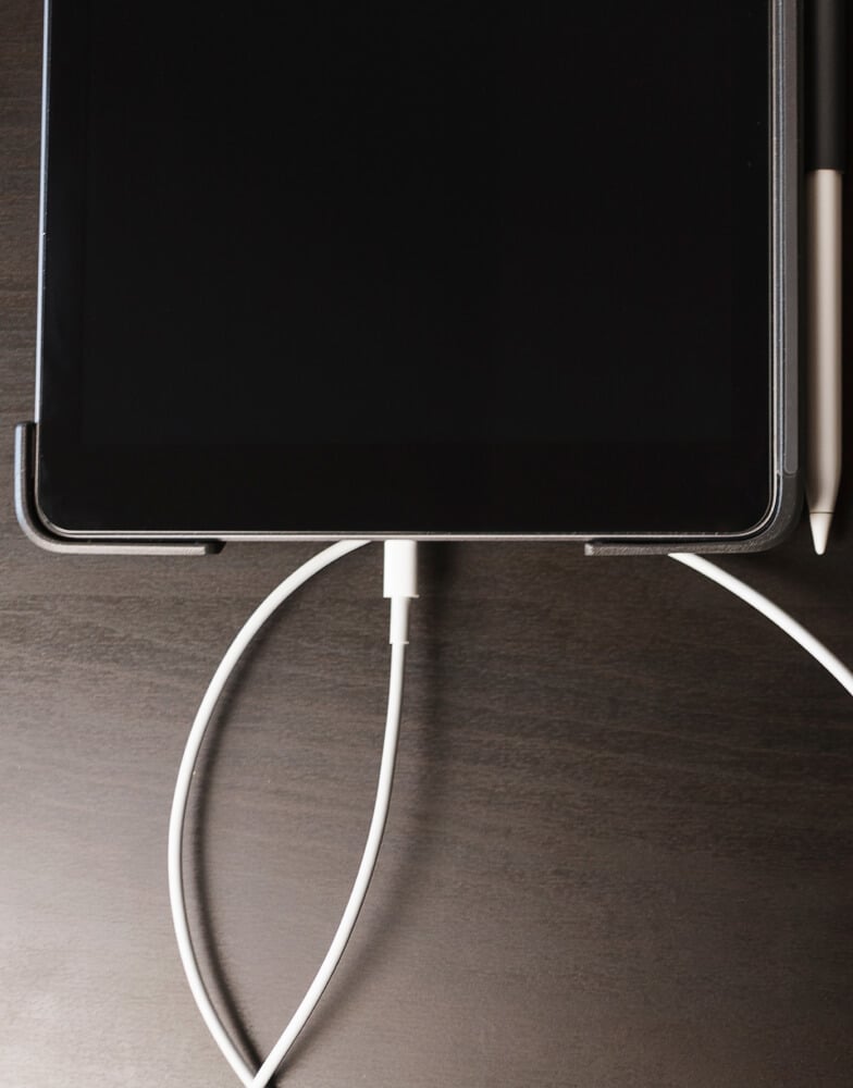 iPad plugged into charging cable