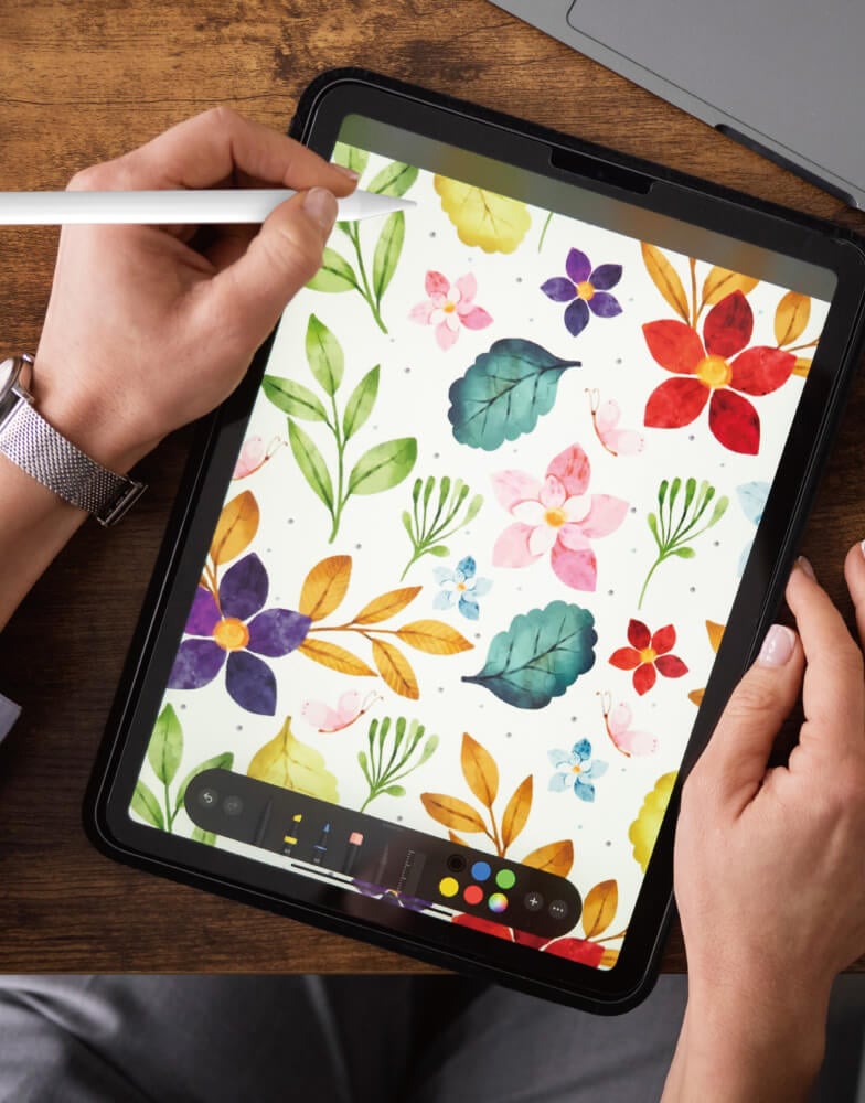 Person using stylus with iPad