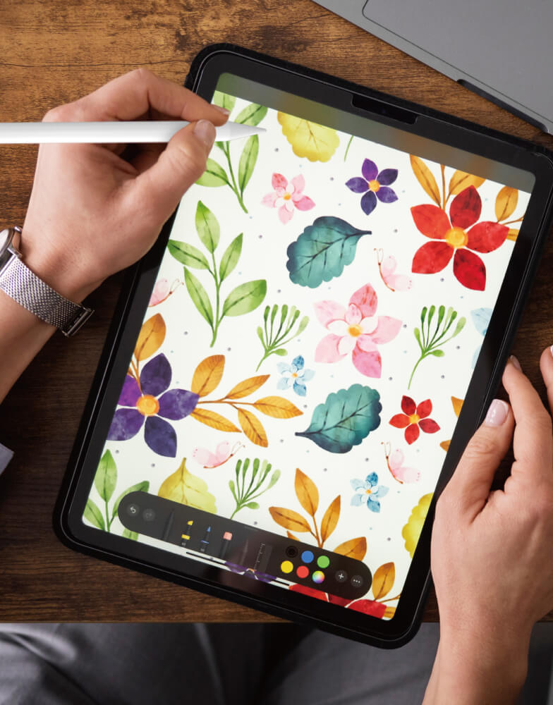 Person using stylus with iPad