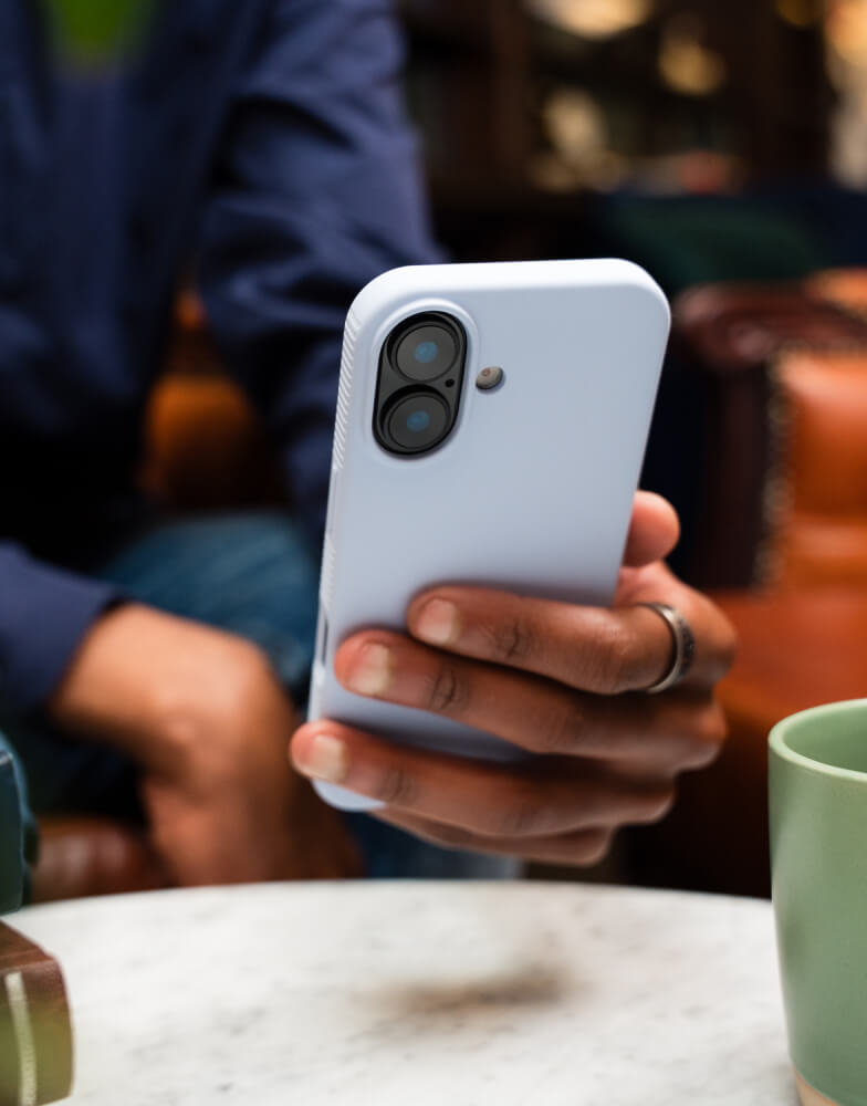 Person holding iPhone with cover