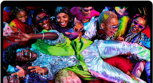 Colourful screen on a MacBook Pro of a person crowdsurfing at a party, showcasing the vibrant Liquid Retina XDR display