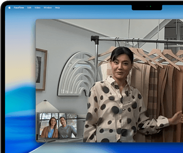 A video call on a MacBook Pro where a woman shows fabrics to two people on the call, with Centre Stage keeping her centred in the frame as she moves around