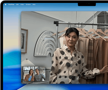 A video call on a MacBook Pro where a woman shows fabrics to two people on the call, with Centre Stage keeping her centred in the frame as she moves around