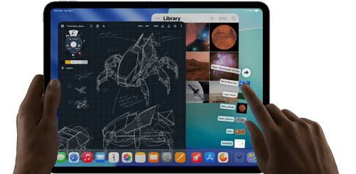 iPad Pro, space black colour, left hand holding device, right hand pointing gesturing to manipulate multiple open app windows, a drawing app with sketches of mechanical designs, photos library of planets and space images, downloads folder files fanned out