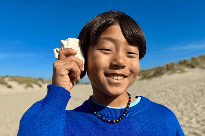 Photo taken with 48MP Fusion camera, next-generation portraits feature in use, focused on a person’s face