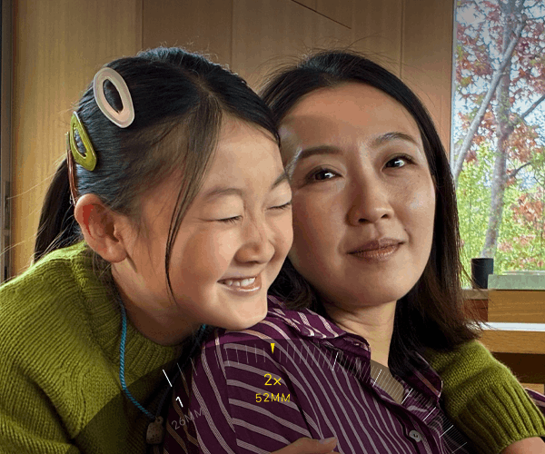 2x Telephoto feature in use, zooming in on mountain covered with trees and vegetation