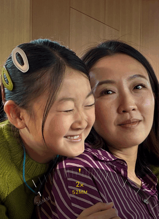 2x Telephoto feature in use, zooming in on mountain covered with trees and vegetation